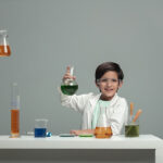 Boy with beakers